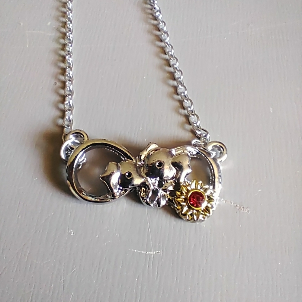 925 Sterling Silver momma and baby elephants necklace with 20 inch chain.